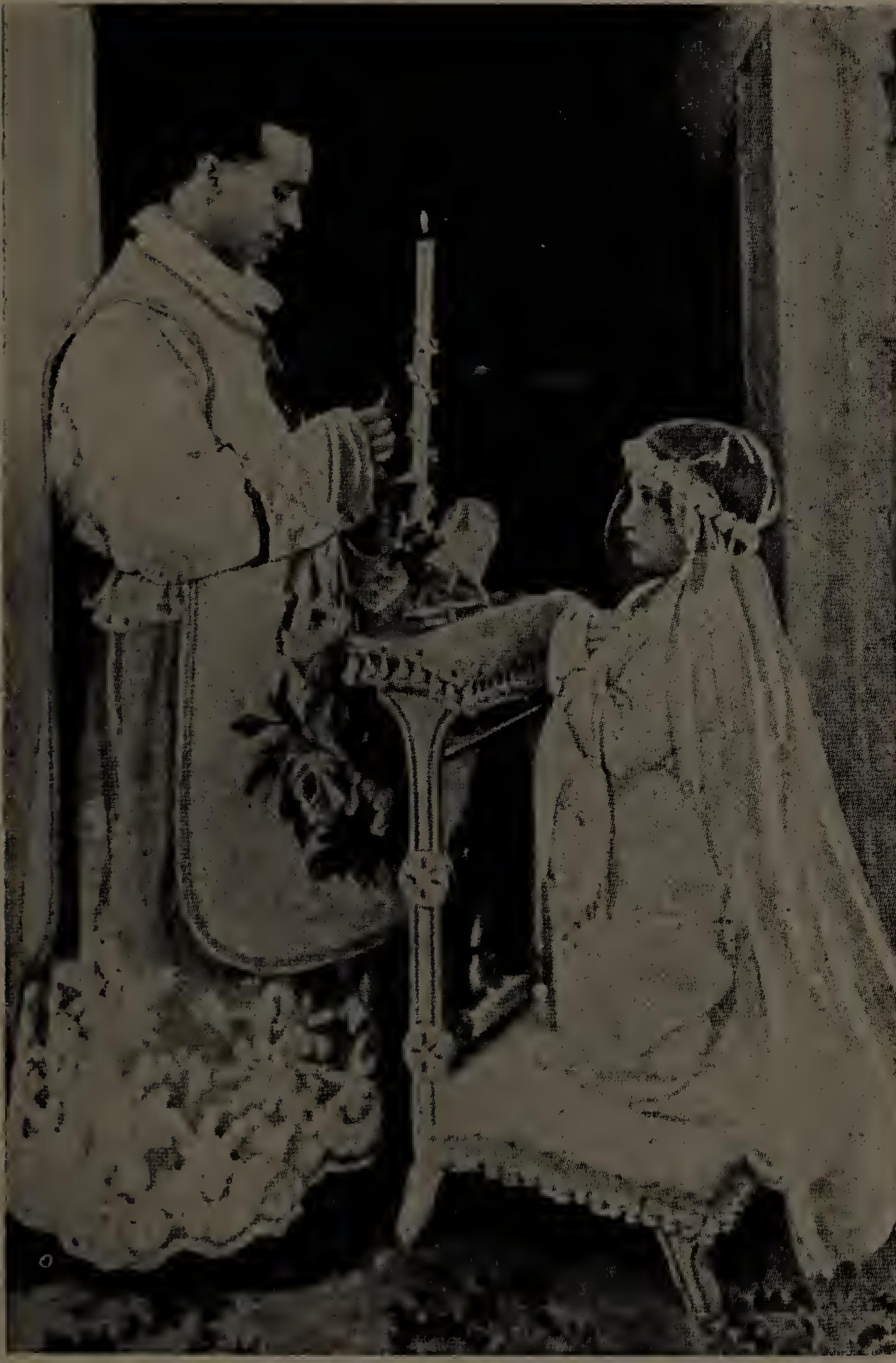 Solà Cômo, a Mexican priest, on the day of his first Mass; his little sister is receiving First Communion from him.  This zealous priest did untold good, in a quiet way, among Mexican Catholics.  The agents of Calles identified him by means of the above photo.  He was shot on April 25, 1927, as he uttered the words:  “For Thy Cause I die, O Lord!”